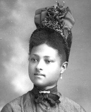English: Dapper young African-American woman w...